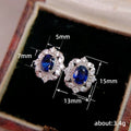 Deep Blue Oval Floral Halo Stud Earrings In Silver Tone view 5
