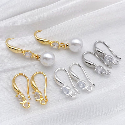 Front overview of u shape earring hooks with clear stone detail arranged by finish and size