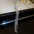 Single Silver Tone Crystal Fringe Clip On Earring with Polished Metal Accents view 1