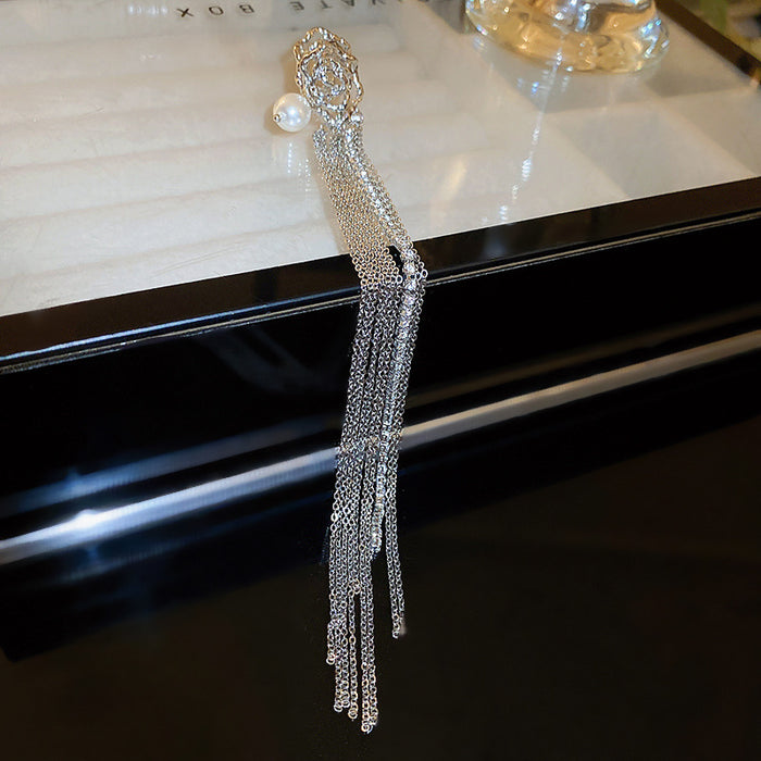 Single Silver Tone Crystal Fringe Clip On Earring with Polished Metal Accents