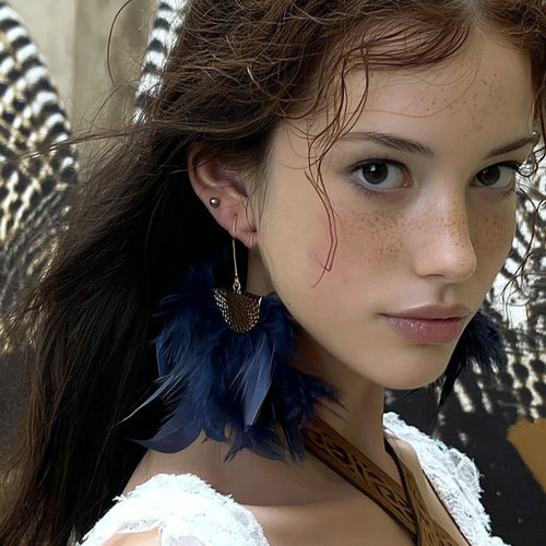 Close view of the colors and surface details on feather tassel fan drop earrings