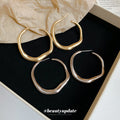 Irregular Rounded Hoop Earrings In Gold And Silver view 4