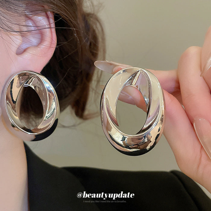 Silver Tone Sculpted Oval Statement Stud Earrings With Polished Metal Details
