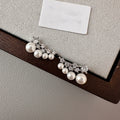 Pair of Metal Tone Pearl Cluster Stud Earrings with Crystal Leaves view 3