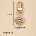 Gold Tone Rhinestone Open Heart Evil Eye Clip Keychains view 4