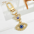 Gold Crystal Evil Eye Keychain With Butterfly And Bear Charm view 2