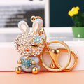 Jeweled Strawberry Holding Rabbit Keychains in Four Pictured Colors view 3