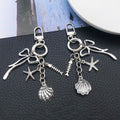 Three Silver Tone Bow Shell and Starfish Clasp Keychains view 2