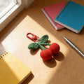 Crocheted Red Cherry Keychain with Green Leaves and Red Metal Clasp view 4