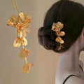 Gold Tone Floral Hair Pin With Textured Petals And Long Leaf Drop view 1