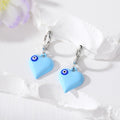 Silver Tone Puffy Heart Evil Eye Huggie Earrings in Five Colors view 4