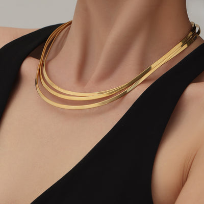 Gold multi-row open collar chokers worn on model