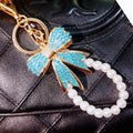 Full Crystal Bow Keychains with Plain Pearl Strand and Fortune Loop Options view 1