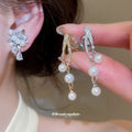 Pearl Cluster Floral Dangle Clip On Earrings With Polished Metal Details view 2