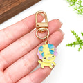 Dog Charm Keychains Featuring Yellow Dog Across 13 Pictured Variations view 1
