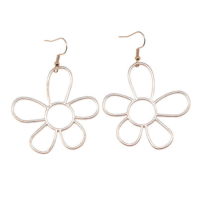 Close-up of open flower drop earrings showing open five-petal flowers suspended from fishhook ear wires