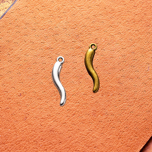 Second product image of the curved chili pepper charm showing a slim curved chili pepper shape with a small top loop