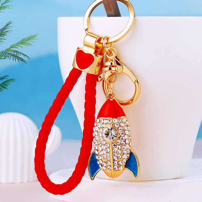 Jeweled Red Rocket Keychain with Blue Fins and Braided Wrist Loop