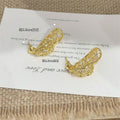 Gold Crystal Open Leaf Stud Earrings with Curved Silhouette view 2