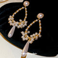 Gold Tone Pearl Look Teardrop Earrings with Long White Drops view 4