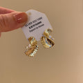 Gold Tone Textured Fan Twist Stud Earrings with Crystals view 3