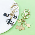 Piano and Music Note Charm Keychains Featuring Cat Across 33 Pictured Variations view 3