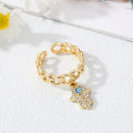 Gold Tone Curb Chain Crystal Evil Eye and Hamsa Charm Rings view 5