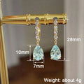 Gold Tone Light Blue Teardrop Drop Earrings Clear Line view 4