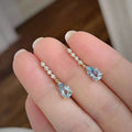 Gold Tone Light Blue Teardrop Drop Earrings Clear Line view 2