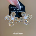 Gold Tone Crystal Petal Flower Stud Earrings With Pearl Centers view 1