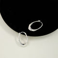Hammered Silver Tone Sculpted Oval Medium Hoop Earrings view 1