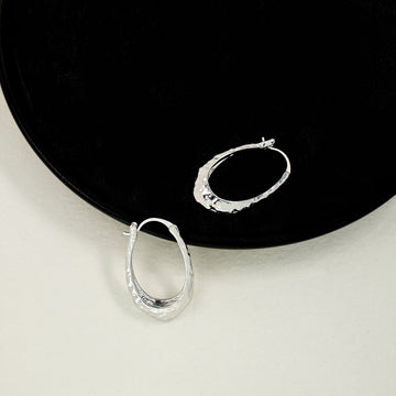 Hammered Silver Tone Sculpted Oval Medium Hoop Earrings