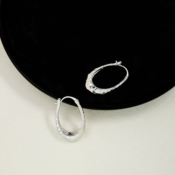 Hammered Silver Tone Sculpted Oval Medium Hoop Earrings
