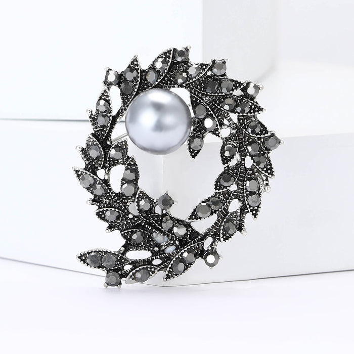 Pearl and Crystal Leaf Wreath Brooch in a Dark Metal Finish