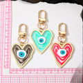 Gold Tone Swirled Heart Evil Eye Clip Keychains in Five Colors view 4
