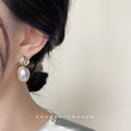 Gold Hammered Disc Stud Oval Pearl Drop Earrings Pair view 2