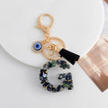 Shell-Chip Resin Letter Keychain with Evil Eye Charm and Tassel view 9