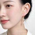 Gold Tone Eight Point Star And White Pearl Hook Earrings view 2