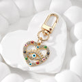 Gold Tone Rhinestone Heart Lash Eye Clip Keychains in Five Colors view 8