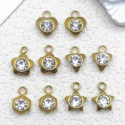 Metallic heart charms arranged on a light background