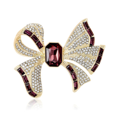 Front view of large striped bow centered by a rectangular stone