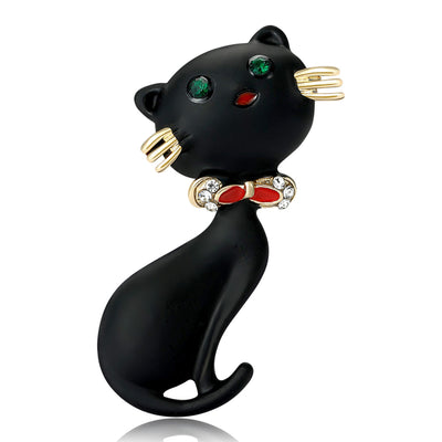 Black enamel cat brooch with green eyes and red bow front view