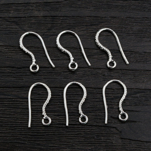 Grouped detail view of fishhook earring wires with a small ball and loop in five finishes