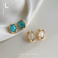 Gold Irregular Bezel Oval Cabochon Stud Earrings Pair view 1
