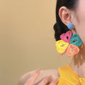 Woven Petal Flower Stud Earrings With Polished Metal Tone Details view 3