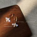 Gold Tone Huggie Hoop Earrings With Clear Stone Bee Drops view 3