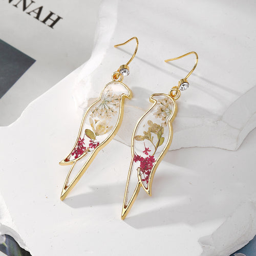 Close-up showing the colors and surface details of gold Tone Pressed Flower Resin Drop Earrings in Three Designs