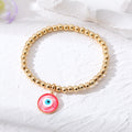 Gold Tone Bead Stretch Bracelets with Round Evil Eye Charms view 2