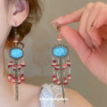 Turquoise Oval Beaded Chandelier Earrings With Red Accents view 1