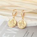 Gold Tone Embossed Cherub Coin Necklace and Huggie Earrings view 3